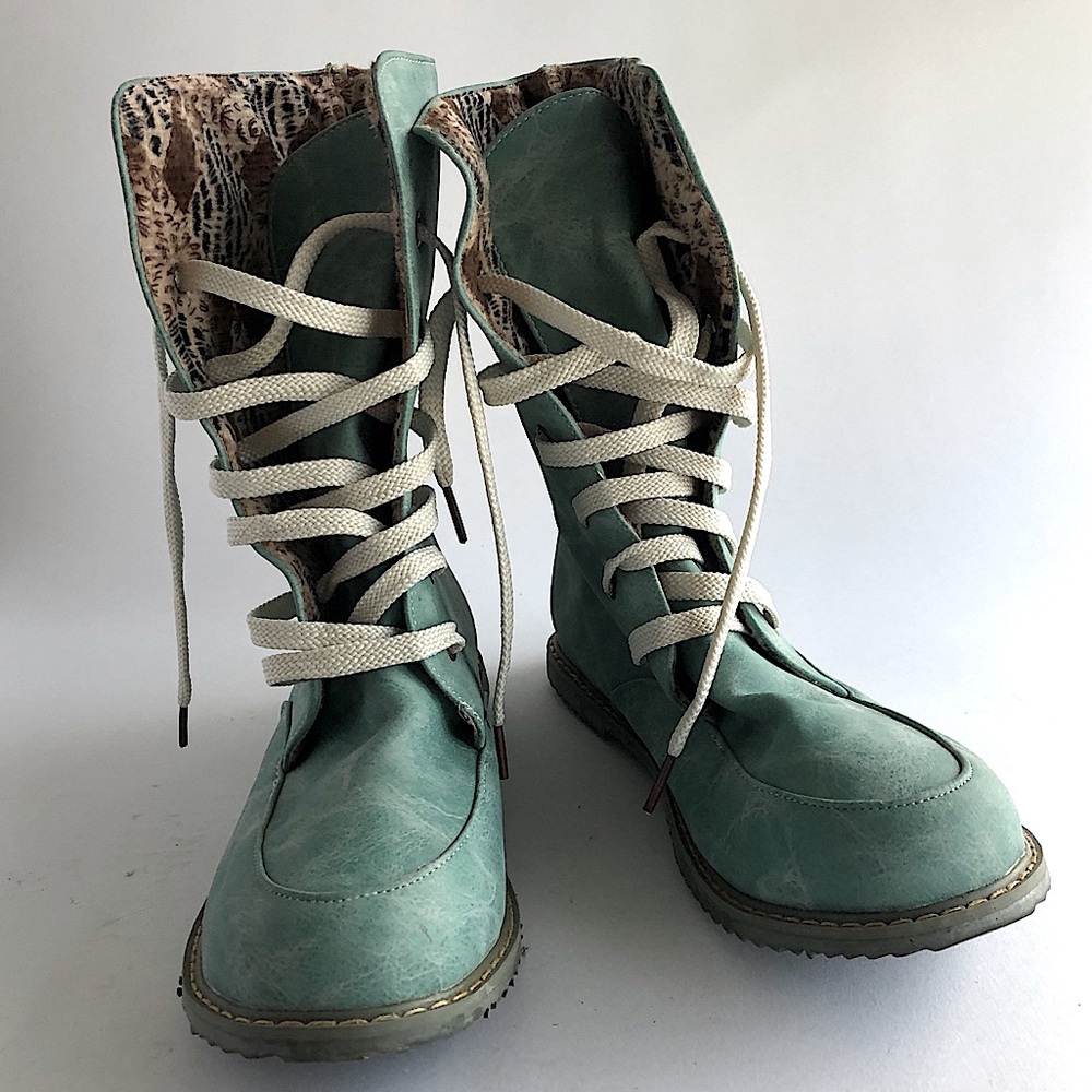Blue lace up boots lined with animal print